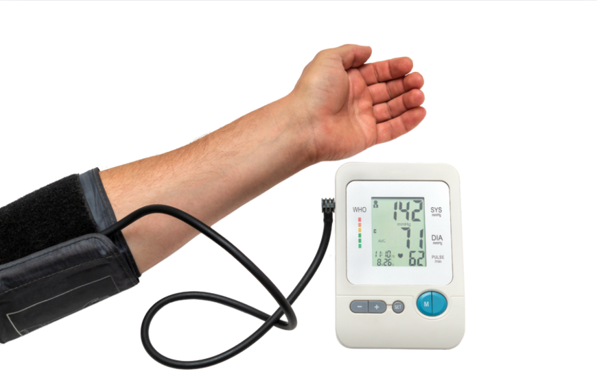 The image shows a person s arm with a blood pressure cuff on it, indicating measurement is being taken, with a visible reading of 140 systolic and 85 diastolic pressure.