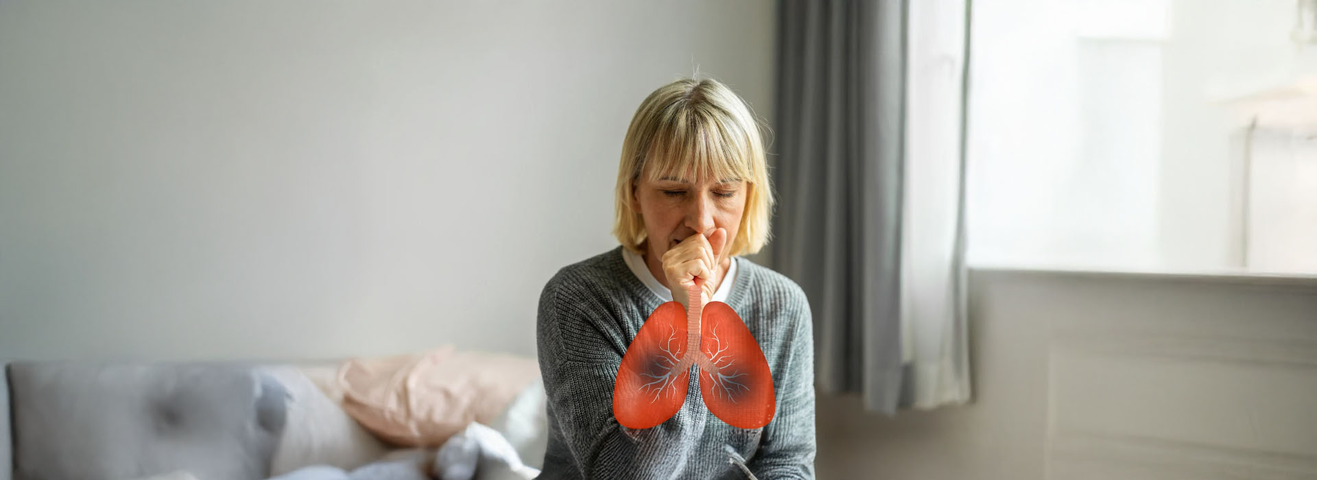 The image depicts a woman sitting on a couch with her head down, wearing a black shirt, and there s a small red flower floating in the air near her face.