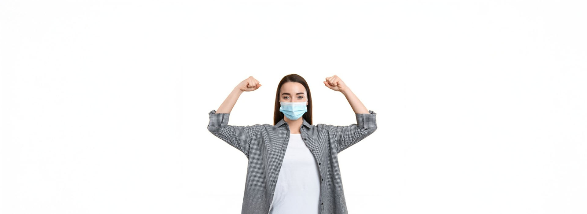 The image features a person wearing a face mask and a long-sleeved shirt, standing with hands on hips against a plain background.