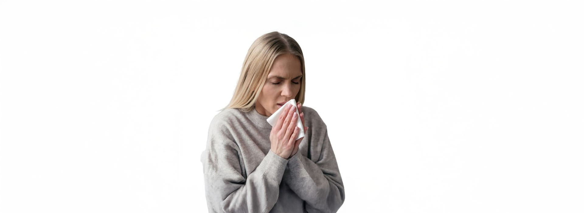 The image shows a person standing with their mouth open, possibly in mid-speech or singing, against a plain background.